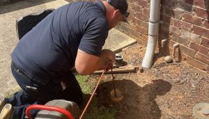 Chen Plumbing Technician Clearing A Drain