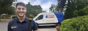Chen Plumbing Technician With Parked Truck