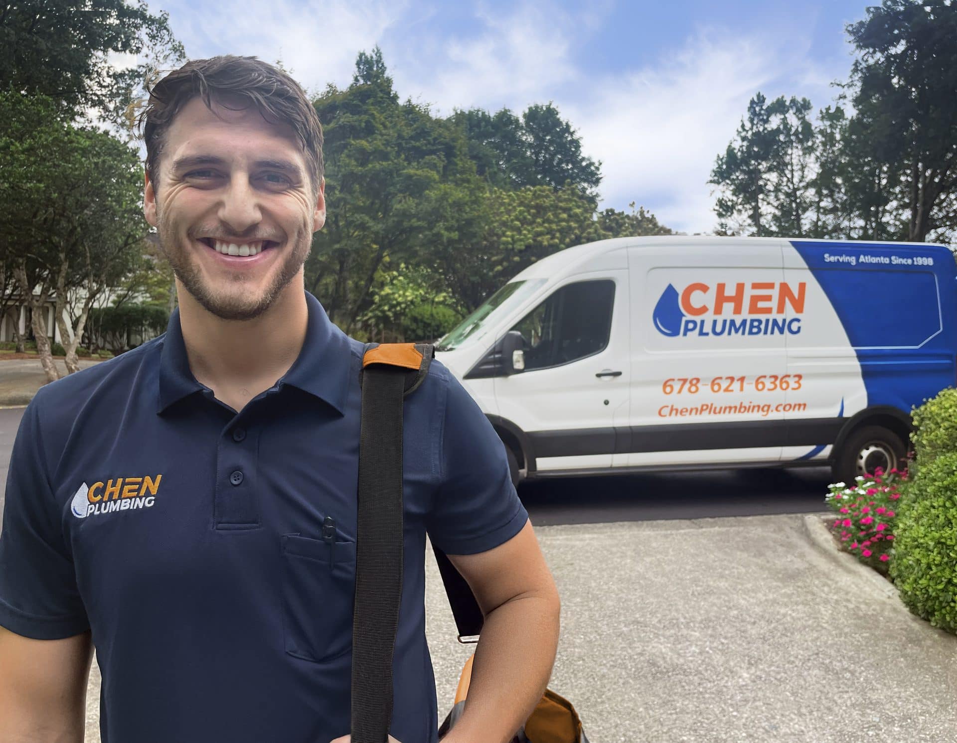 Chen Plumbing technician with truck in an Atlanta neighborhood